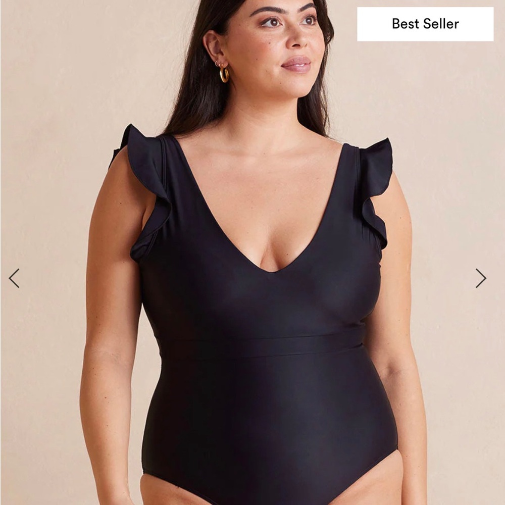 A deep V front, a stunning open back, and flirty ruffles.